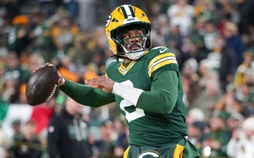 Quarterback Malik Willis preparing to throw a pass on the football field