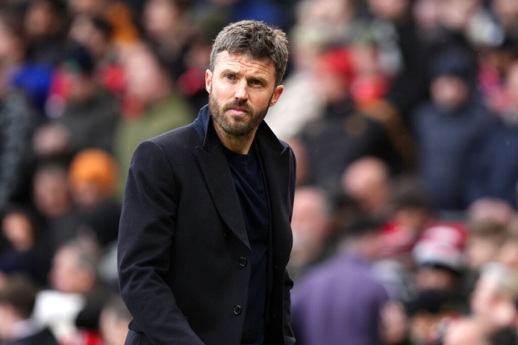 Manchester United manager Michael Carrick speaking to the media on the touchline