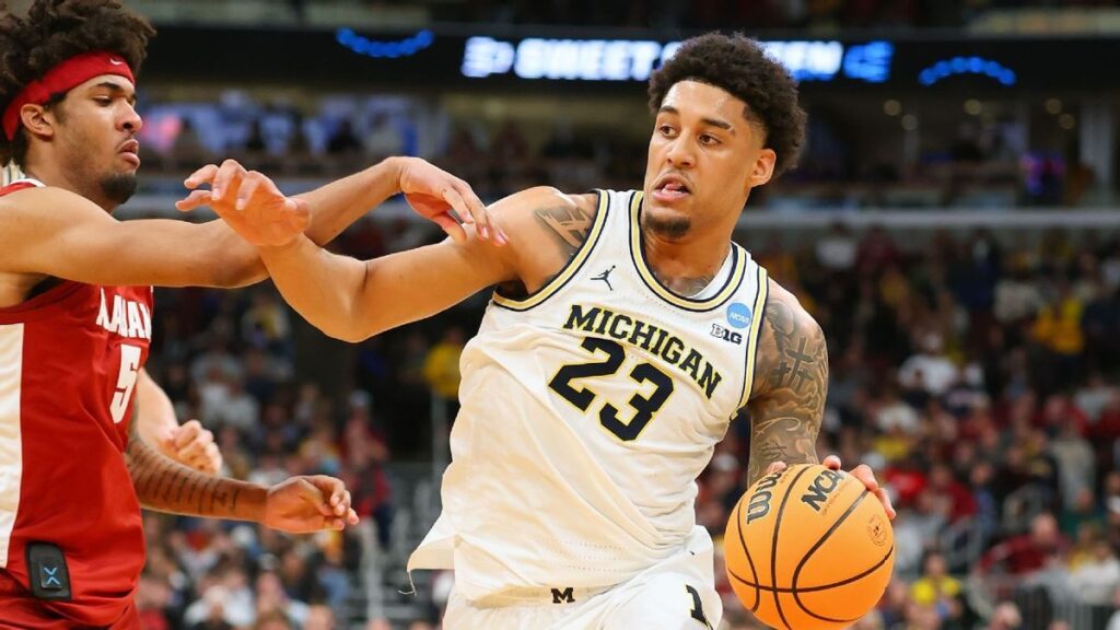 Yaxel Lendeborg of the Michigan Wolverines dribbling the basketball during the NCAA tournament match against Alabama