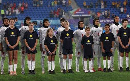 Airport departure board showing cancelled flights amid Middle East sporting disruptions