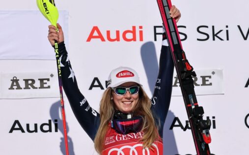 Mikaela Shiffrin skiing aggressively through slalom gates on a snowy course in Sweden