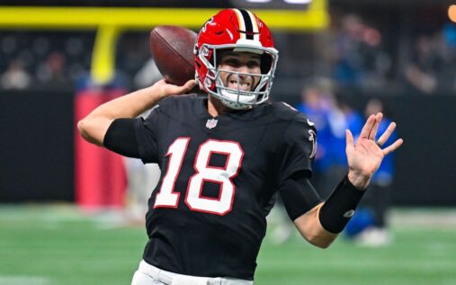 Minnesota Vikings quarterback J.J. McCarthy looking on from the sidelines during an NFL game