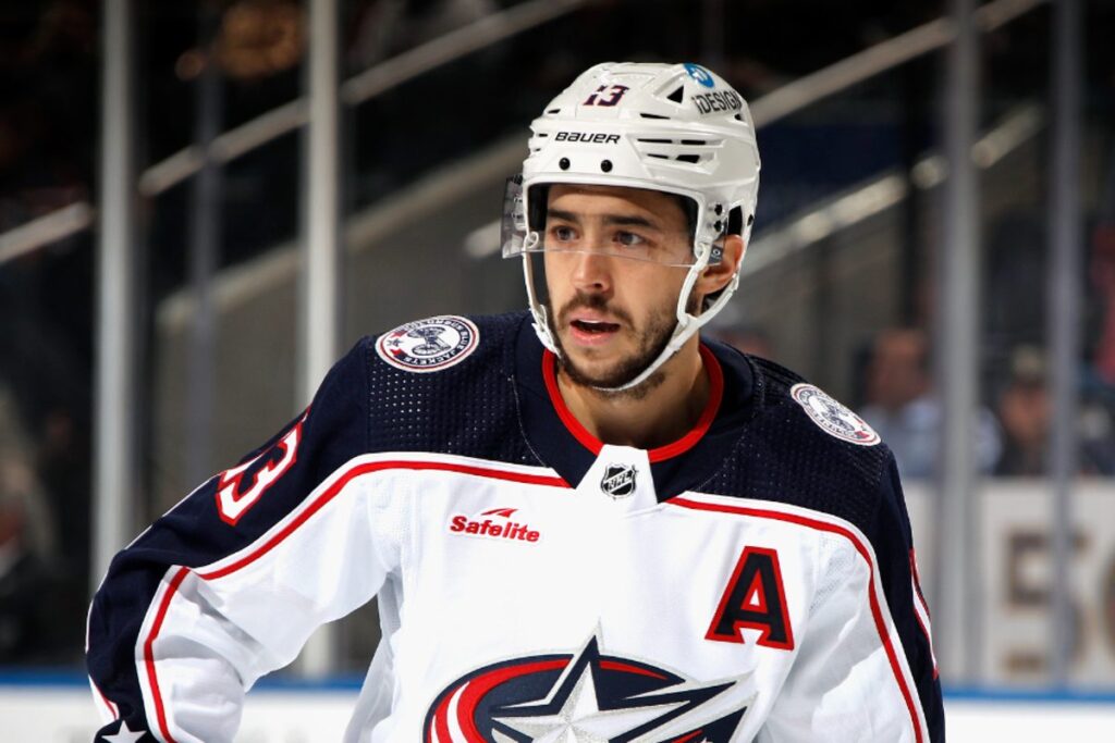 Portrait of NHL star Johnny Gaudreau skating on the ice