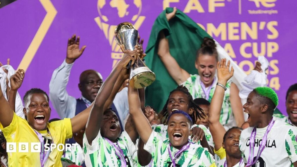 The Women's Africa Cup of Nations trophy displayed on a podium ahead of a match in Morocco