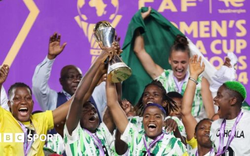 The Women's Africa Cup of Nations trophy displayed on a podium ahead of a match in Morocco