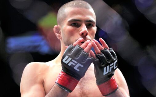 Muhammad Mokaev posing with his arms raised after a mixed martial arts victory