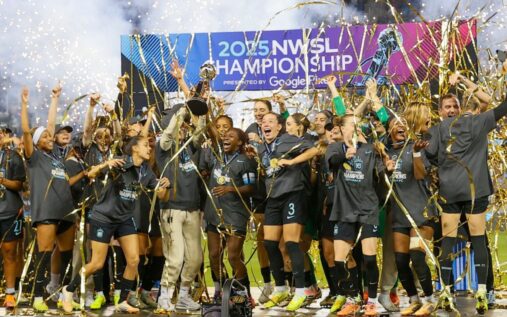 Kansas City Current players celebrating on the pitch during an NWSL match