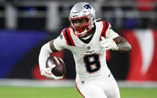 Stefon Diggs warming up in a New England Patriots uniform before an NFL game