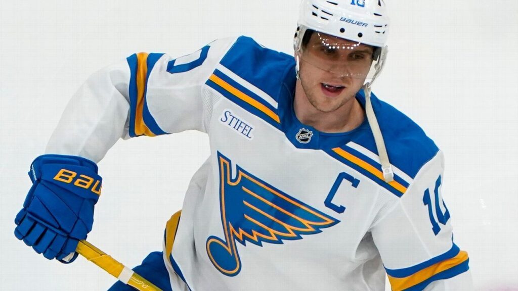 Brayden Schenn skating in St Louis Blues uniform during an NHL match