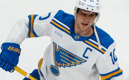 Brayden Schenn skating in St Louis Blues uniform during an NHL match