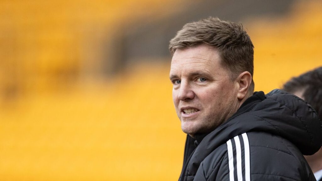 Eddie Howe standing on the touchline managing Newcastle United during a Premier League match