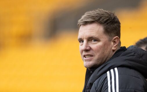 Eddie Howe standing on the touchline managing Newcastle United during a Premier League match