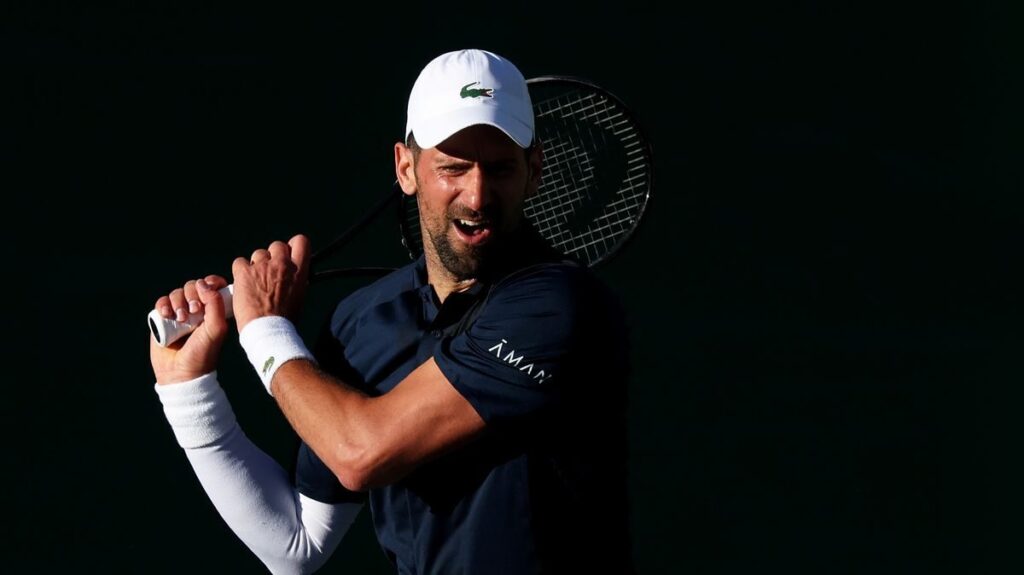 Novak Djokovic looking disappointed on court during a tennis match