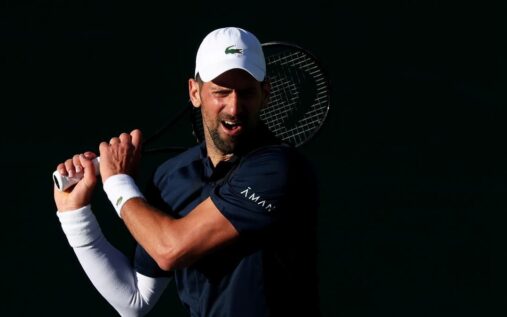 Novak Djokovic looking disappointed on court during a tennis match