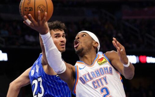 Shai Gilgeous-Alexander of the Oklahoma City Thunder dribbling a basketball during an NBA match