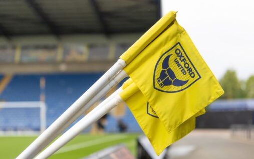 The Oxford United club crest displayed on a flag at a football stadium