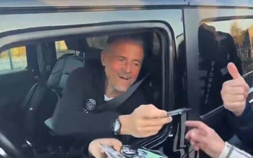 Luis Enrique smiling on the touchline during a Paris Saint-Germain match