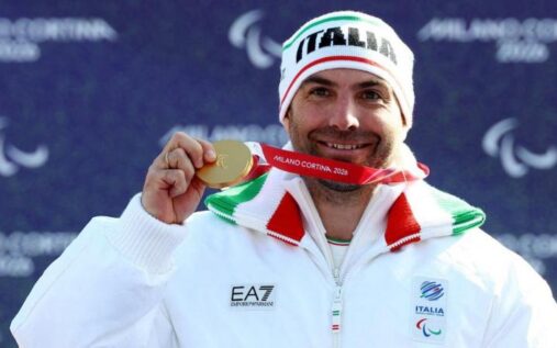 Emanuel Perathoner celebrating his snowboard cross victory at the Winter Paralympics