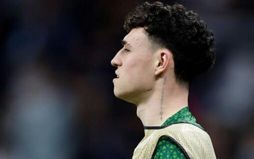 Phil Foden looking dejected on the Manchester City substitutes bench during a Premier League match