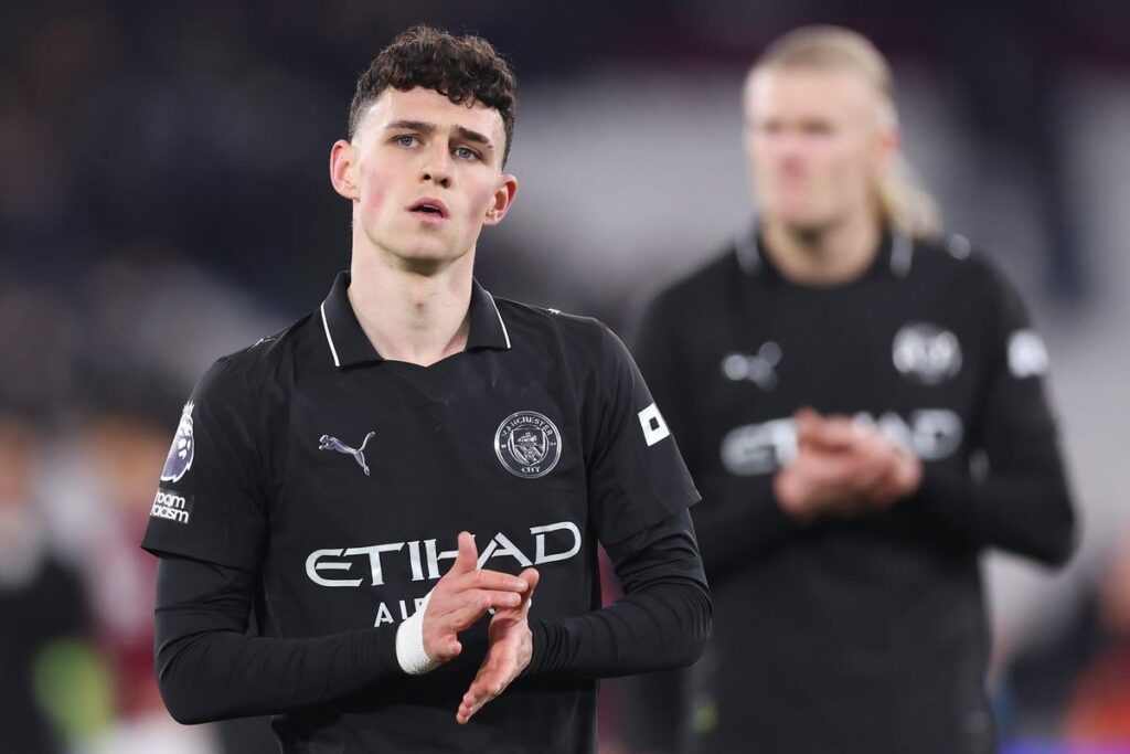 Phil Foden playing for Manchester City in a Premier League match