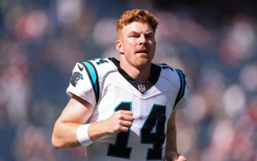 Andy Dalton looking downfield while playing in a National Football League game