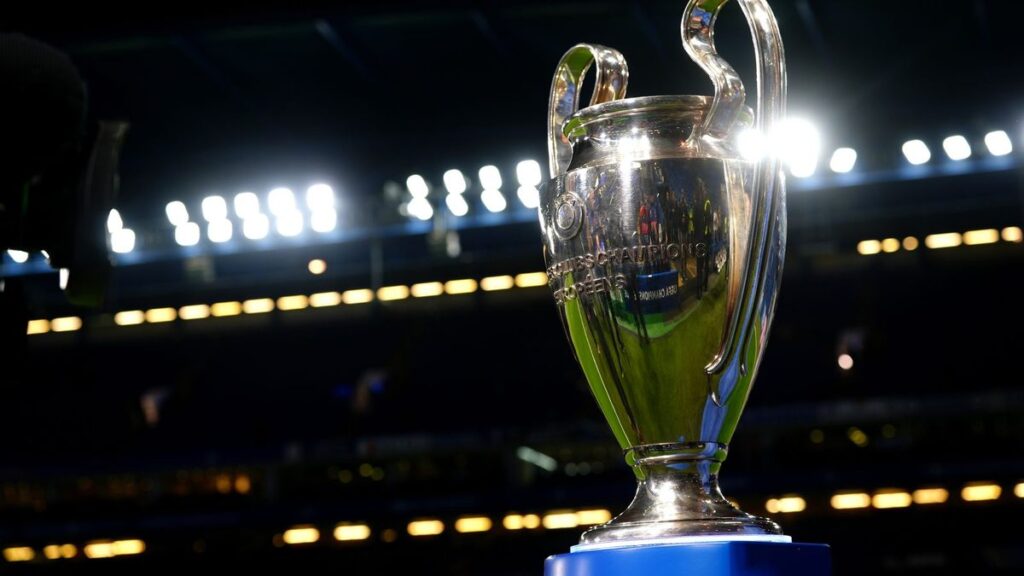 The Champions League trophy displayed alongside the Premier League logo