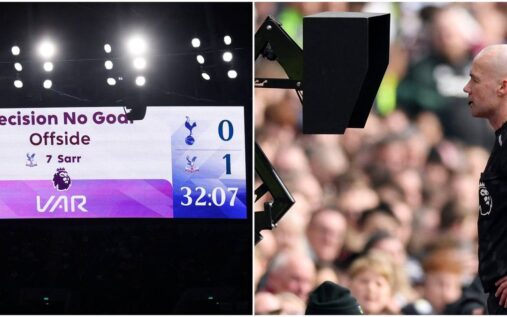 A football referee checking the pitch-side VAR monitor during a Premier League match.