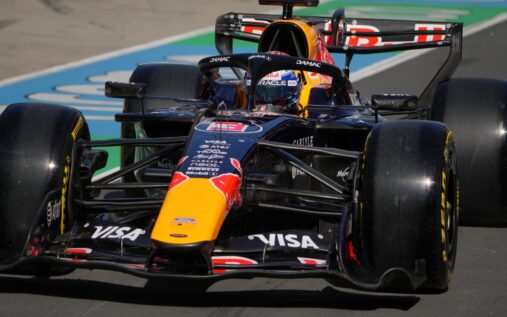 Max Verstappen looking disappointed next to the Red Bull RB21 Formula 1 car at the Chinese Grand Prix