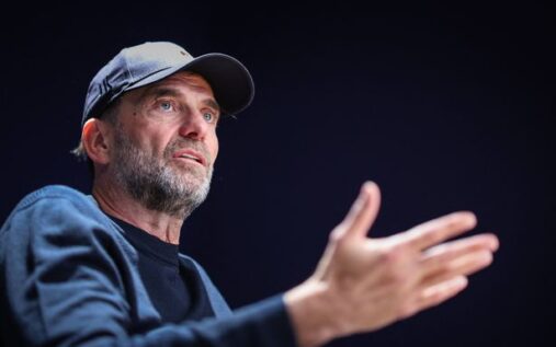 Jurgen Klopp looking thoughtful while wearing Red Bull apparel on the touchline