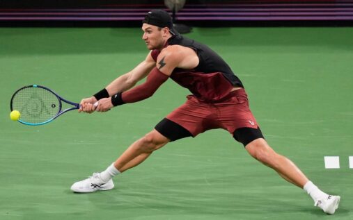 Reilly Opelka serving a tennis ball during his Miami Open match against Jack Draper