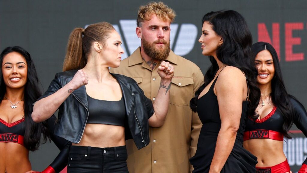 Ronda Rousey and Gina Carano facing off at a press conference to promote their upcoming mixed martial arts bout