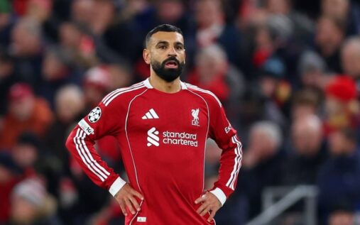 Mohamed Salah looking disappointed on the pitch in a Liverpool kit