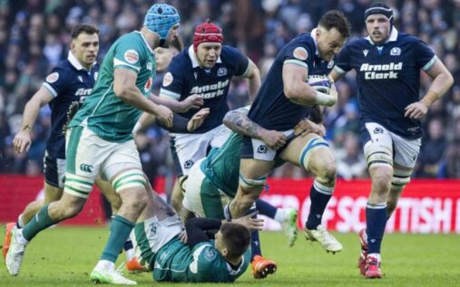 Scotland and Ireland rugby union players contesting a physical ruck during a Six Nations match