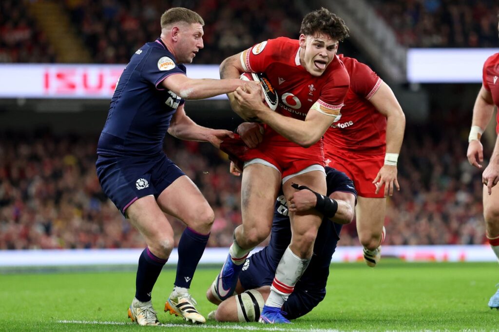 Wales centre Eddie James running with the ball during a Six Nations training session