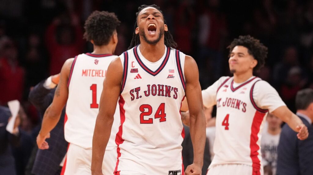 St. John's players celebrating their Big East tournament championship victory on the court at Madison Square Garden