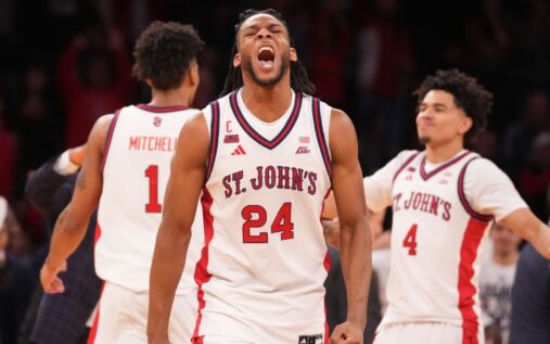 St. John's players celebrating their Big East tournament championship victory on the court at Madison Square Garden