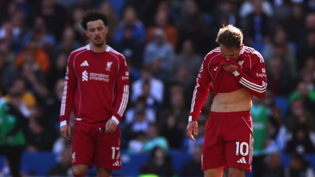 A dejected Arne Slot looking down on the touchline during Liverpool's Premier League defeat against Brighton.