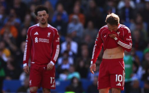 A dejected Arne Slot looking down on the touchline during Liverpool's Premier League defeat against Brighton.