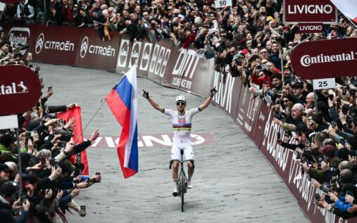 Tadej Pogacar bowing to the crowd in Siena after winning Strade Bianche