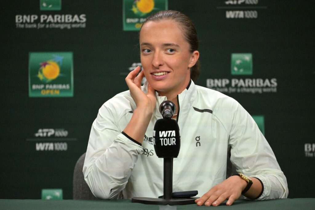 Iga Swiatek and Coco Gauff speaking to reporters during a press conference