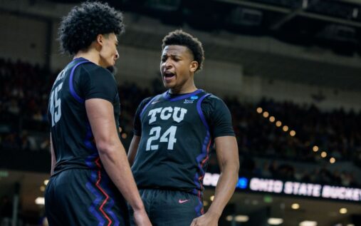 Xavier Edmonds and David Punch celebrating TCU's basketball victory against Ohio State