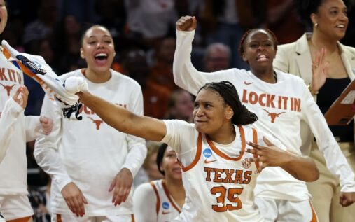 Texas Longhorns women's basketball players celebrating their regional final victory on the court