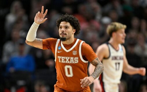 Texas Longhorns basketball players celebrating on court during the NCAA Tournament