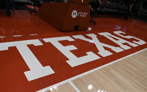 Texas Longhorns players celebrating a basket during a women's college basketball game