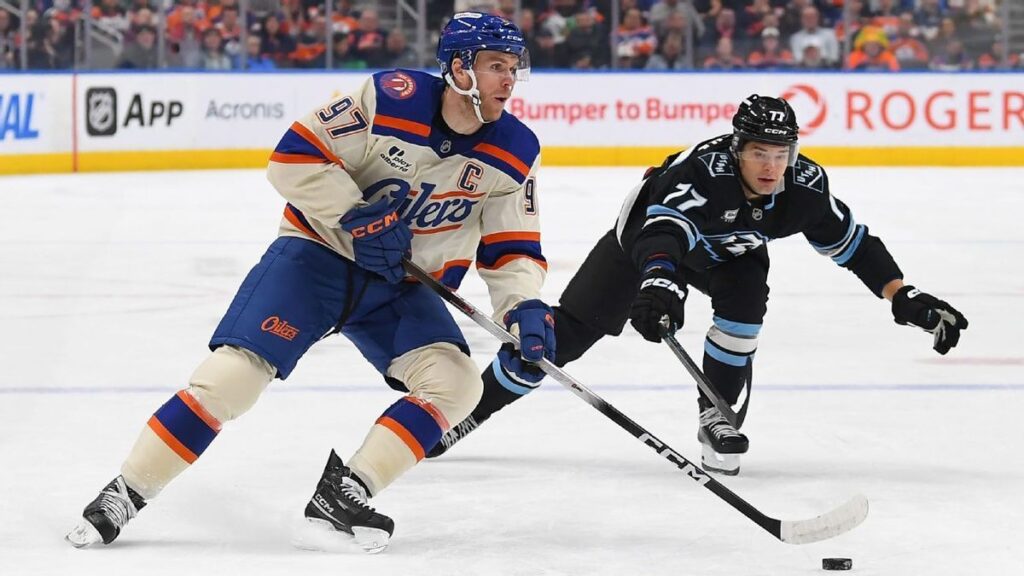 NHL players battling for the puck during a high-stakes ice hockey game