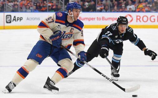 NHL players battling for the puck during a high-stakes ice hockey game