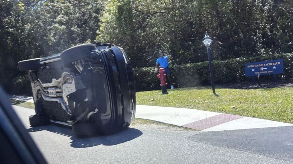 Tiger Woods looking serious while speaking to the media at a press conference