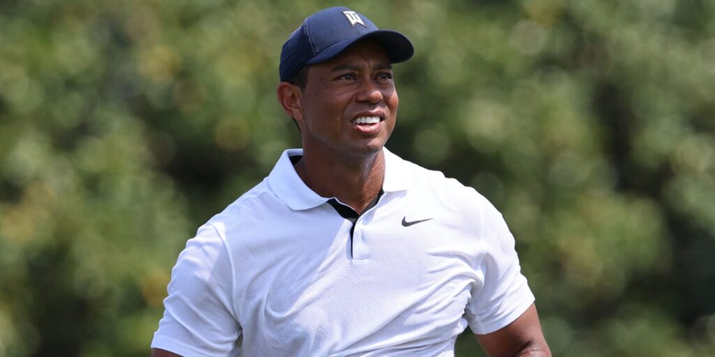 Tiger Woods looking thoughtful on the golf course during a PGA Tour event