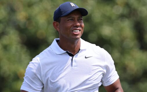 Tiger Woods looking thoughtful on the golf course during a PGA Tour event