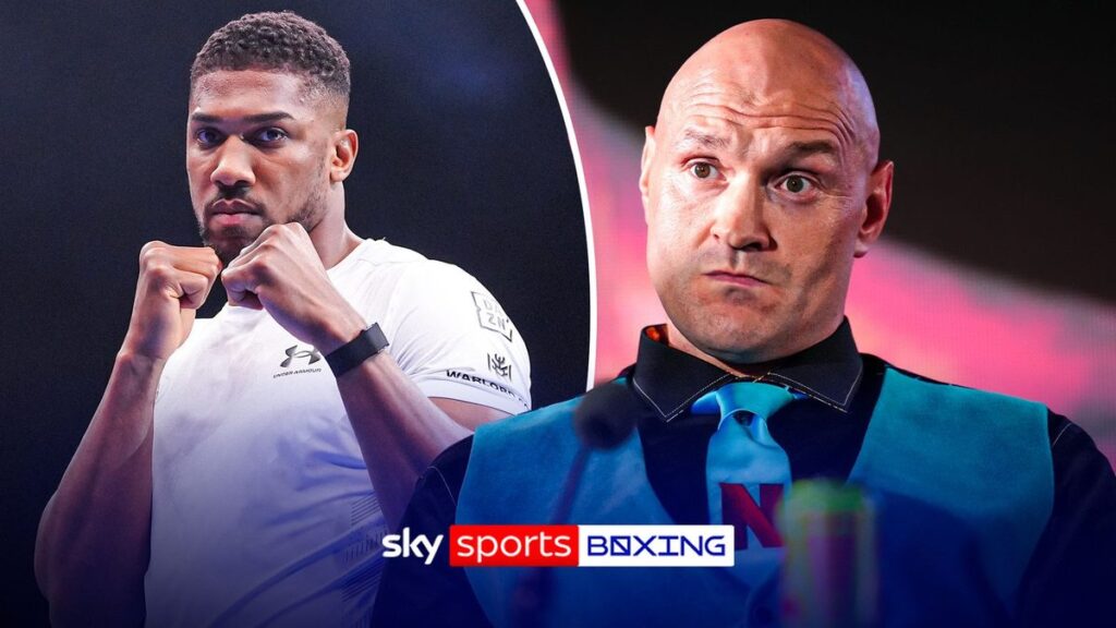 Anthony Joshua and Tyson Fury facing off in a boxing ring